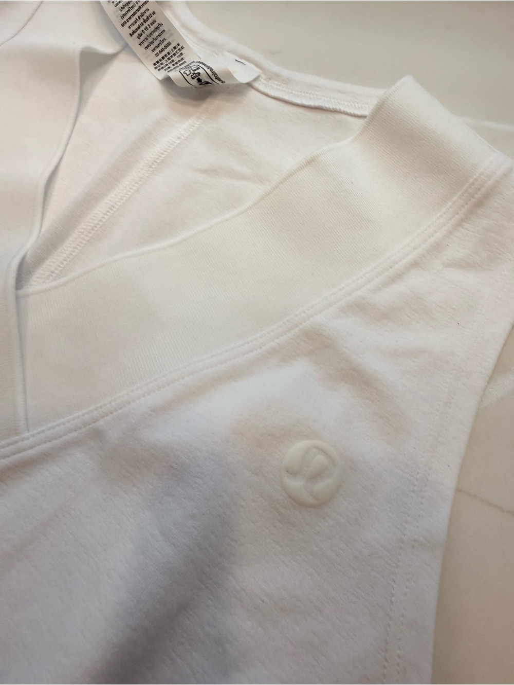 lululemon white sleeveless tank with subtle logo tag